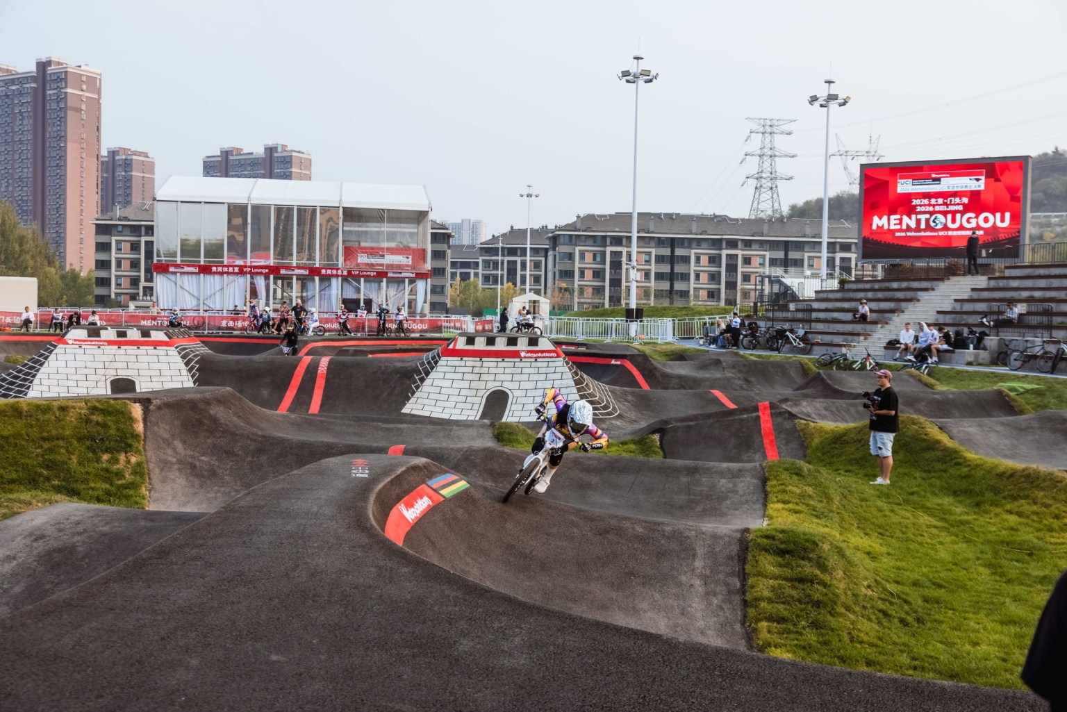 The Mentougou pump track with the Great Wall Towers and the Mentougou screen